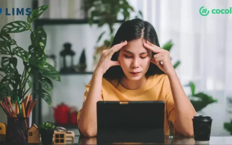 a medical school student sitting depressed in front of laptop