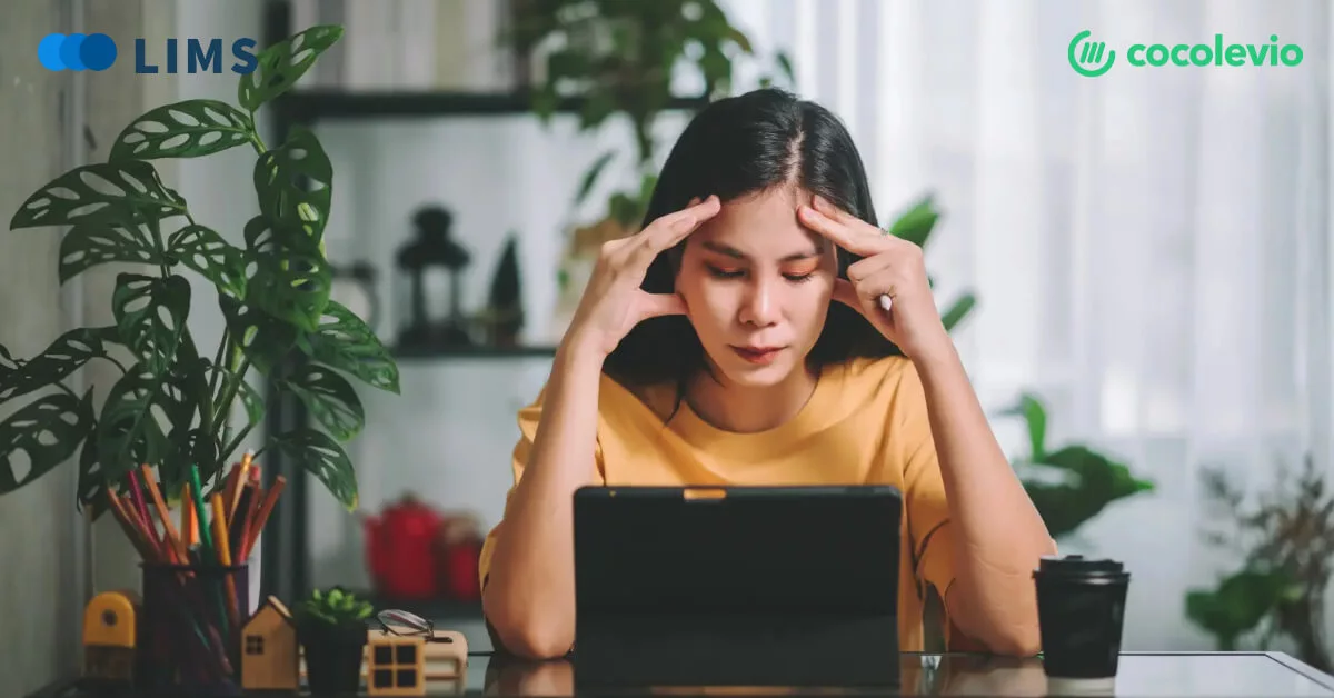 a medical school student sitting depressed in front of laptop